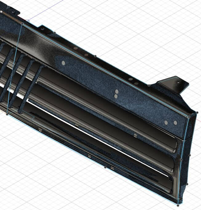 Scandatei_2 Ansicht einer 3D-Datei eines Kühlergrills. Die Datei wurde auf Basis eines 3D-Scans mit 3D Skizzen und Flächen im Reverse-Engineering nachmodelliert.